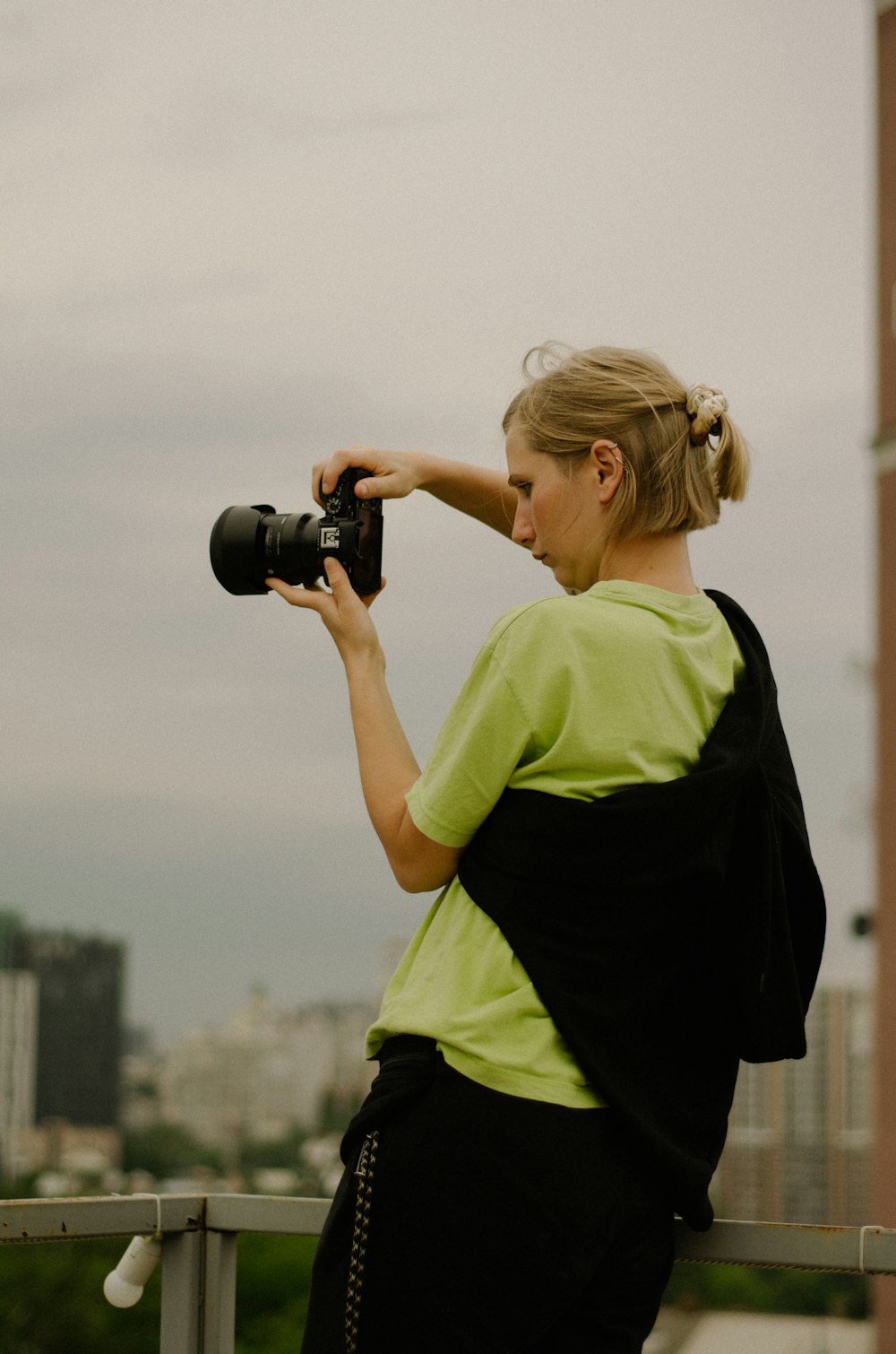 a woman taking a picture with a camera