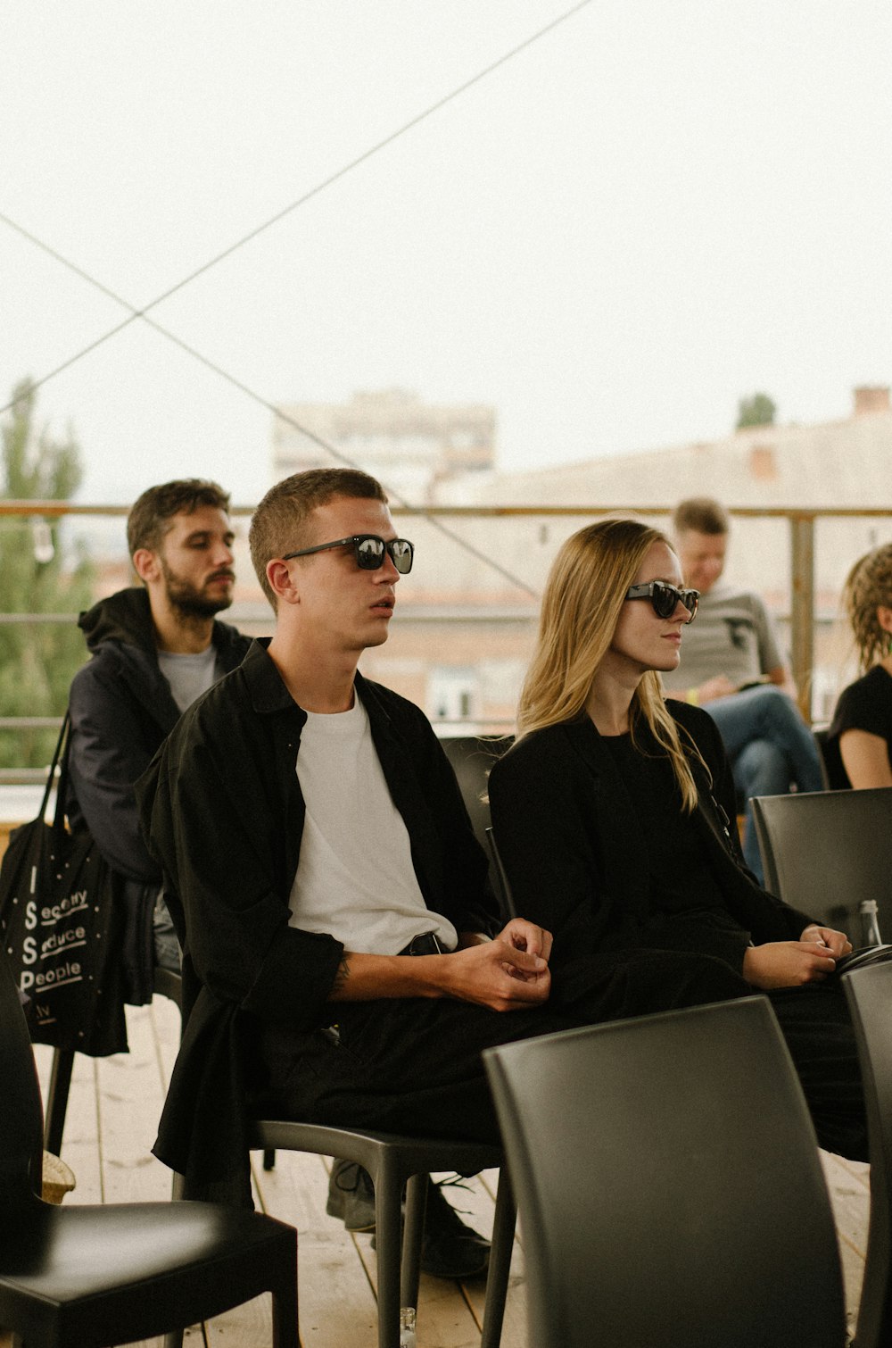 a group of people sitting next to each other