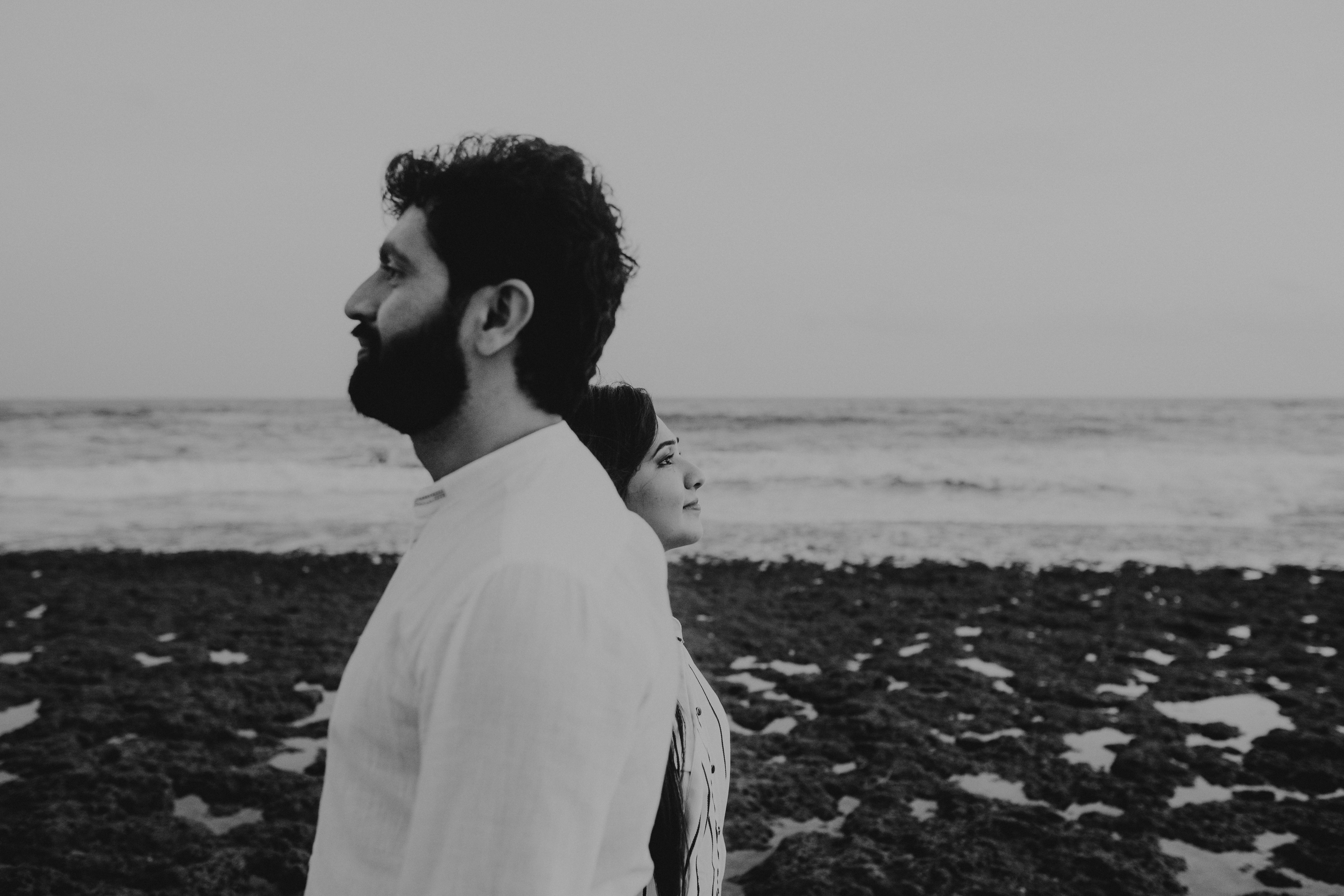 a black and white photo of a man and a woman