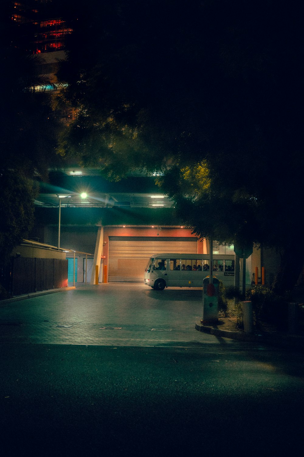 a bus parked in a parking lot at night