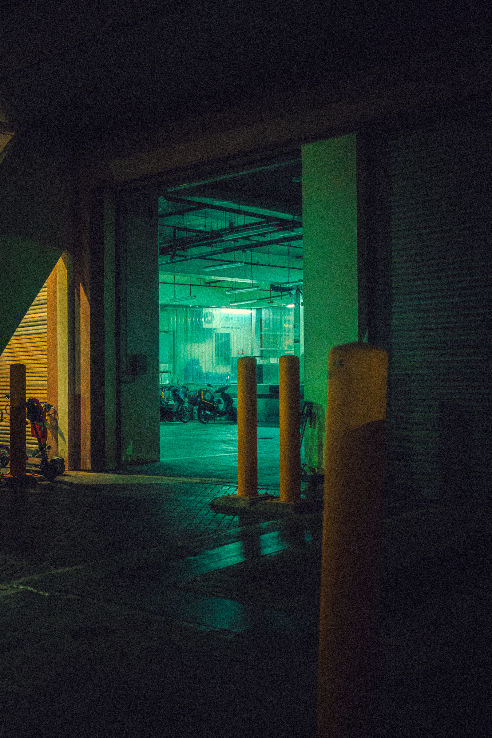 A multi level parking structure lit from within at night