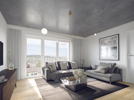 a living room filled with furniture and a flat screen tv