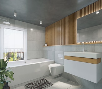 a bathroom with a toilet, sink, and bathtub