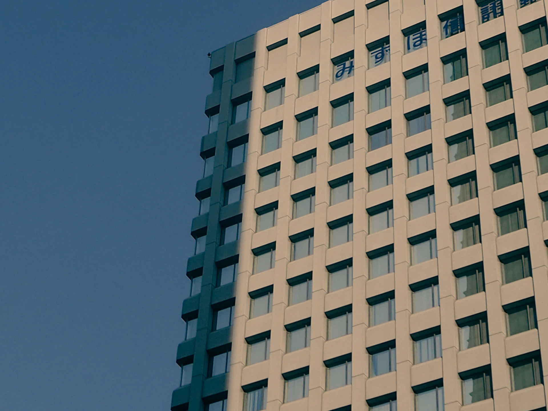 woman wearing yellow long-sleeved dress under white clouds and blue sky during daytime
