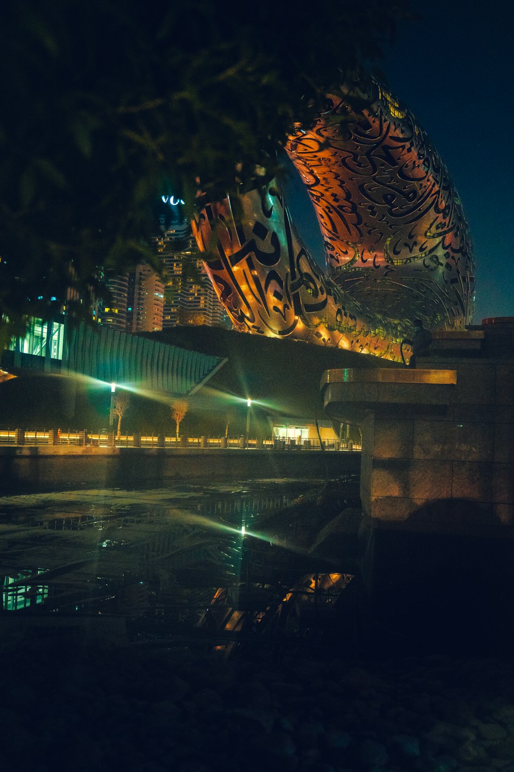 a view of a city at night from across the river