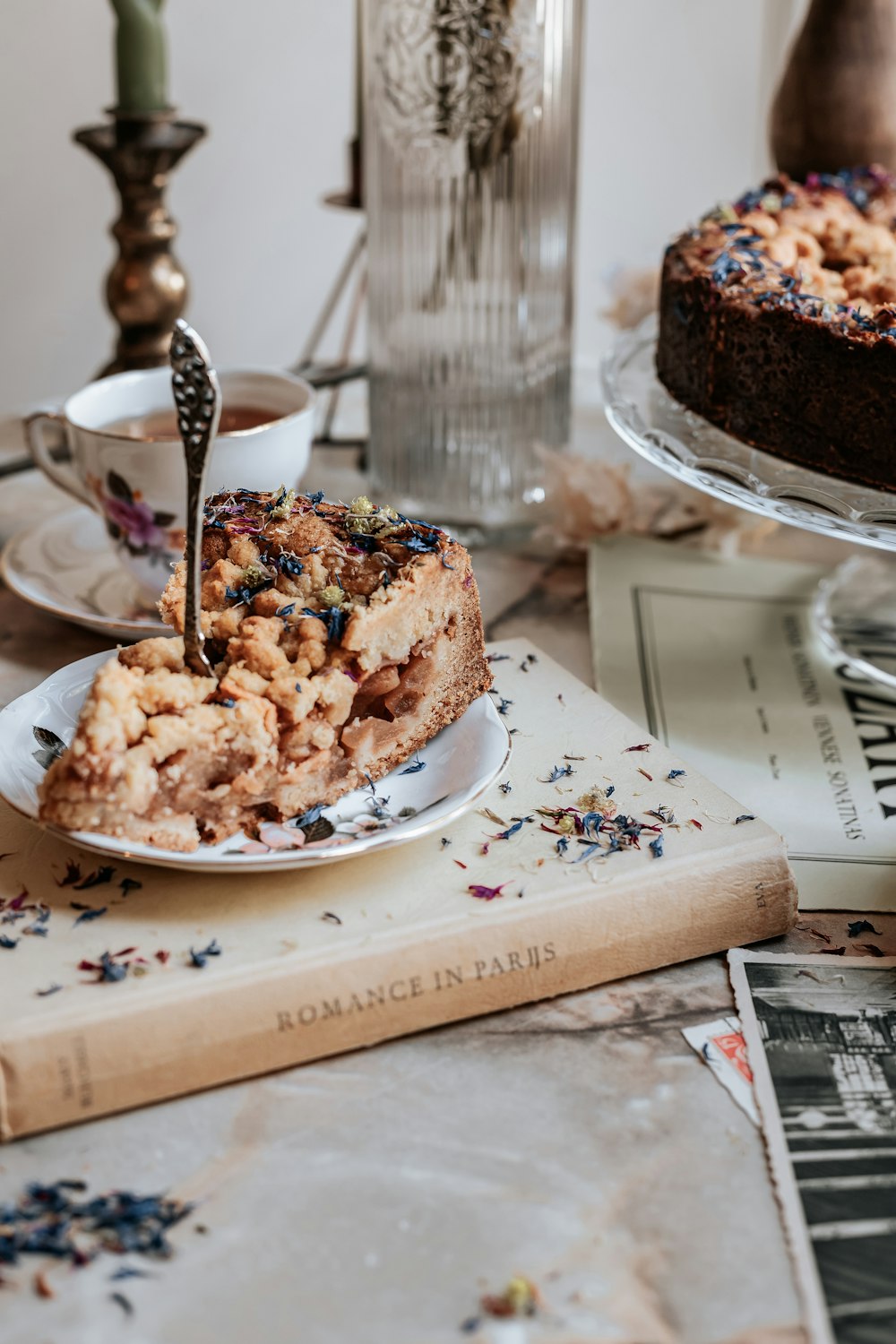 a plate of food that is on a cutting board with a cake