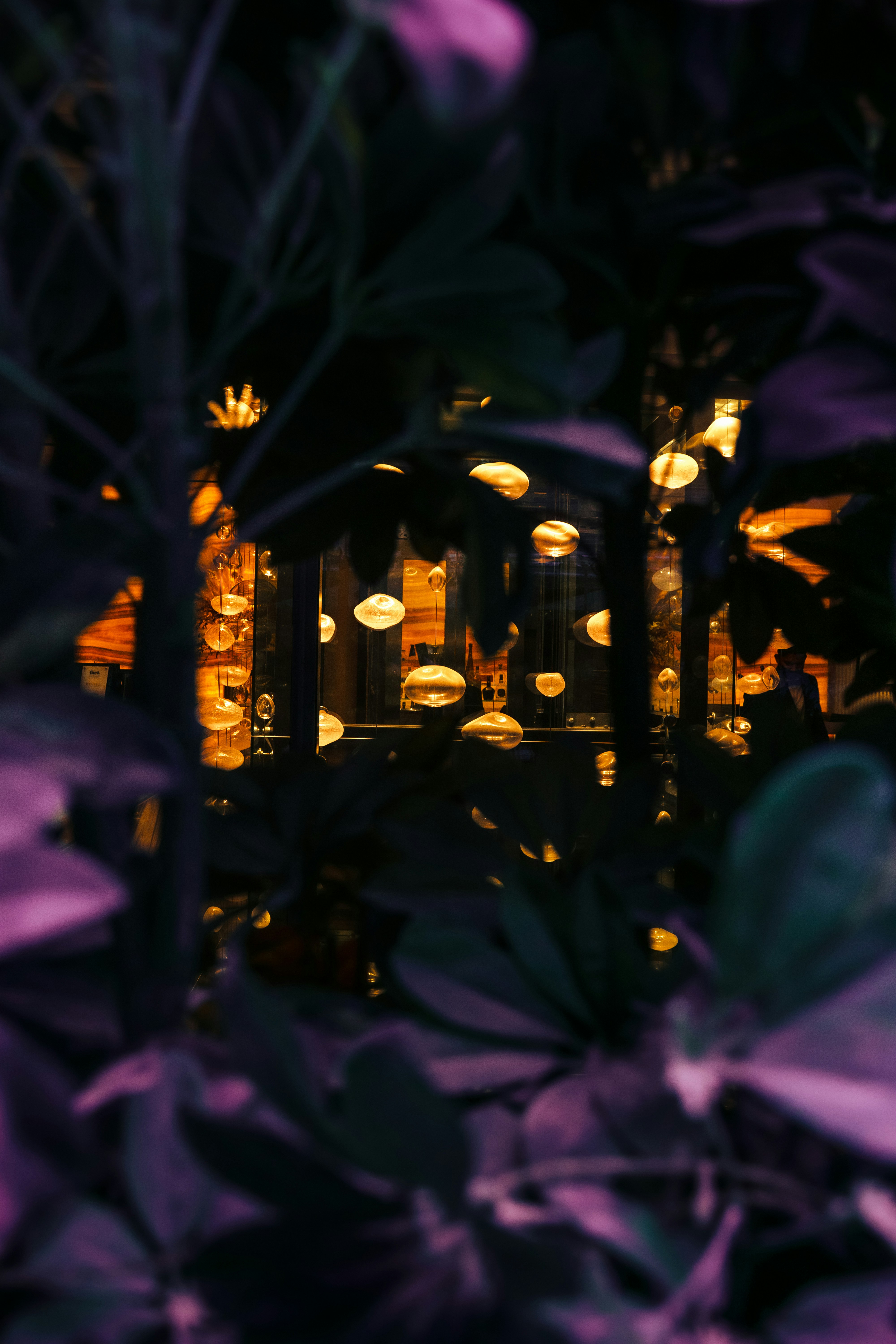 a blurry photo of a building with lights in the background