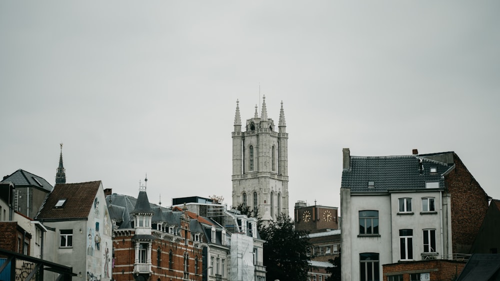 a large cathedral towering over a city filled with tall buildings