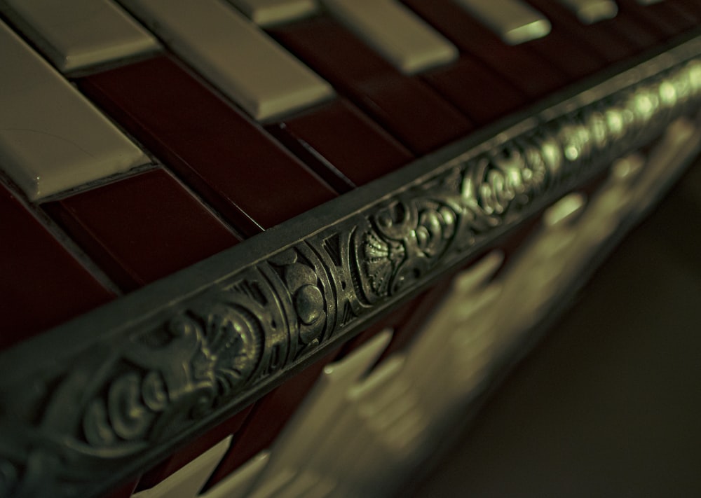 a close up of a metal and glass shelf