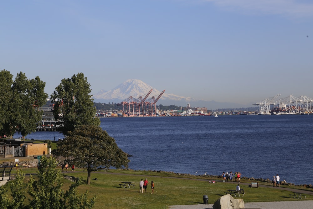 a large body of water with a mountain in the background