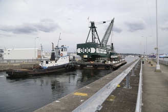 a tug boat is docked at a dock