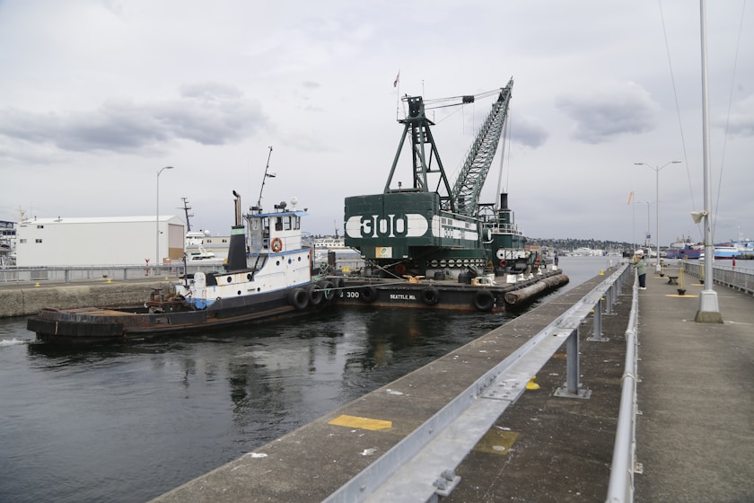 a tug boat is docked at a dock