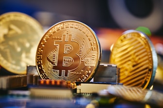 a bit coin sitting on top of a computer chip
