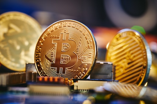 a bit coin sitting on top of a computer chip
