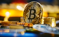 a bitcoin sitting on top of a computer chip