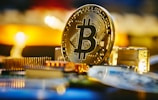a bitcoin sitting on top of a computer chip