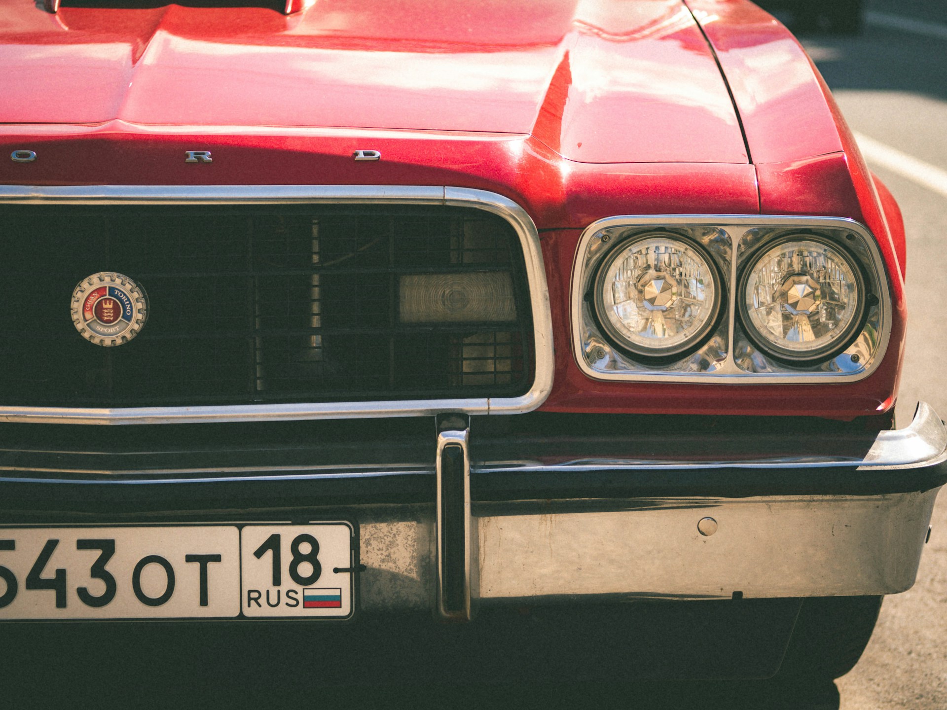 a close up of the front of a red car