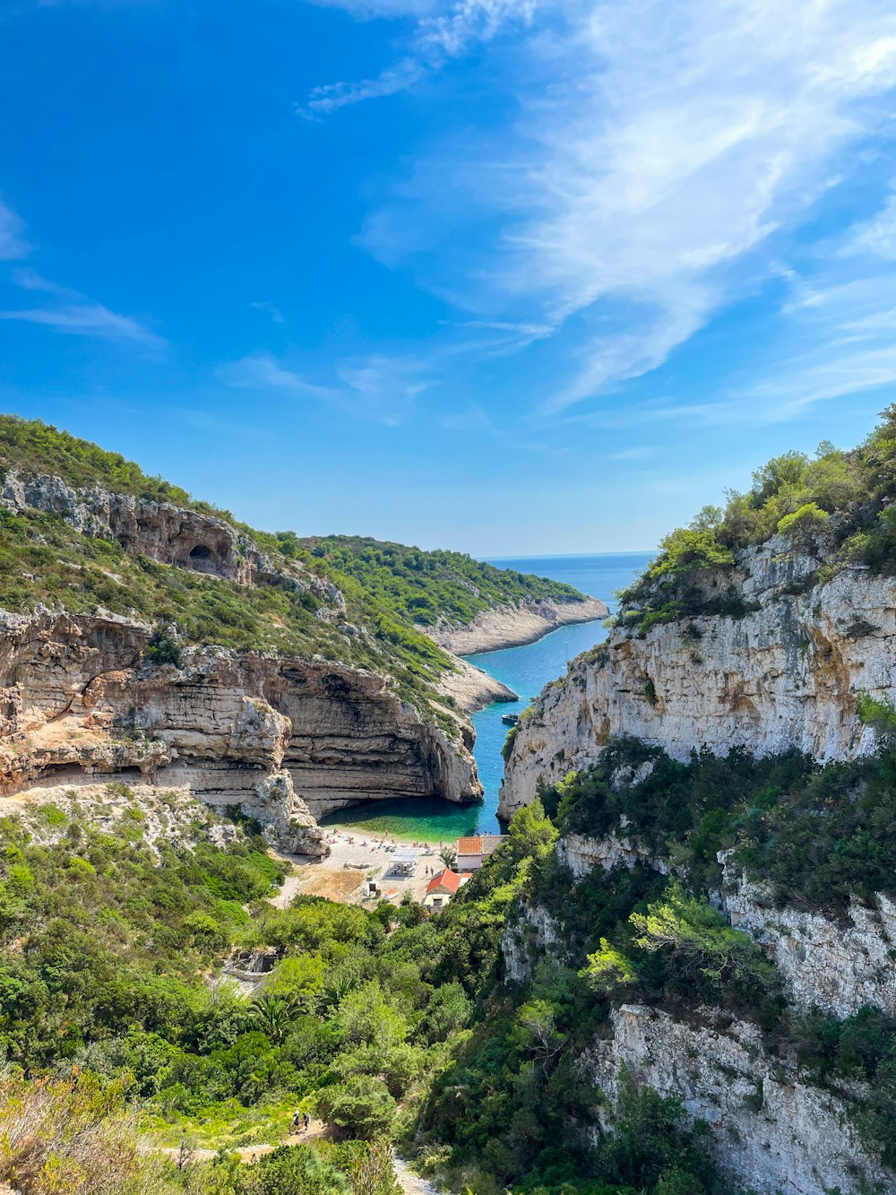 a scenic view of a body of water surrounded by mountains