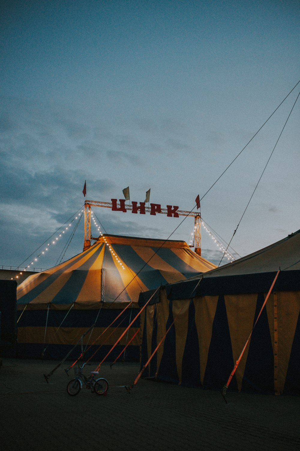 a circus tent with a bicycle parked in front of it
