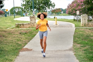 A cheerful person using a fitness calculator app on their smartphone while jogging in a park.