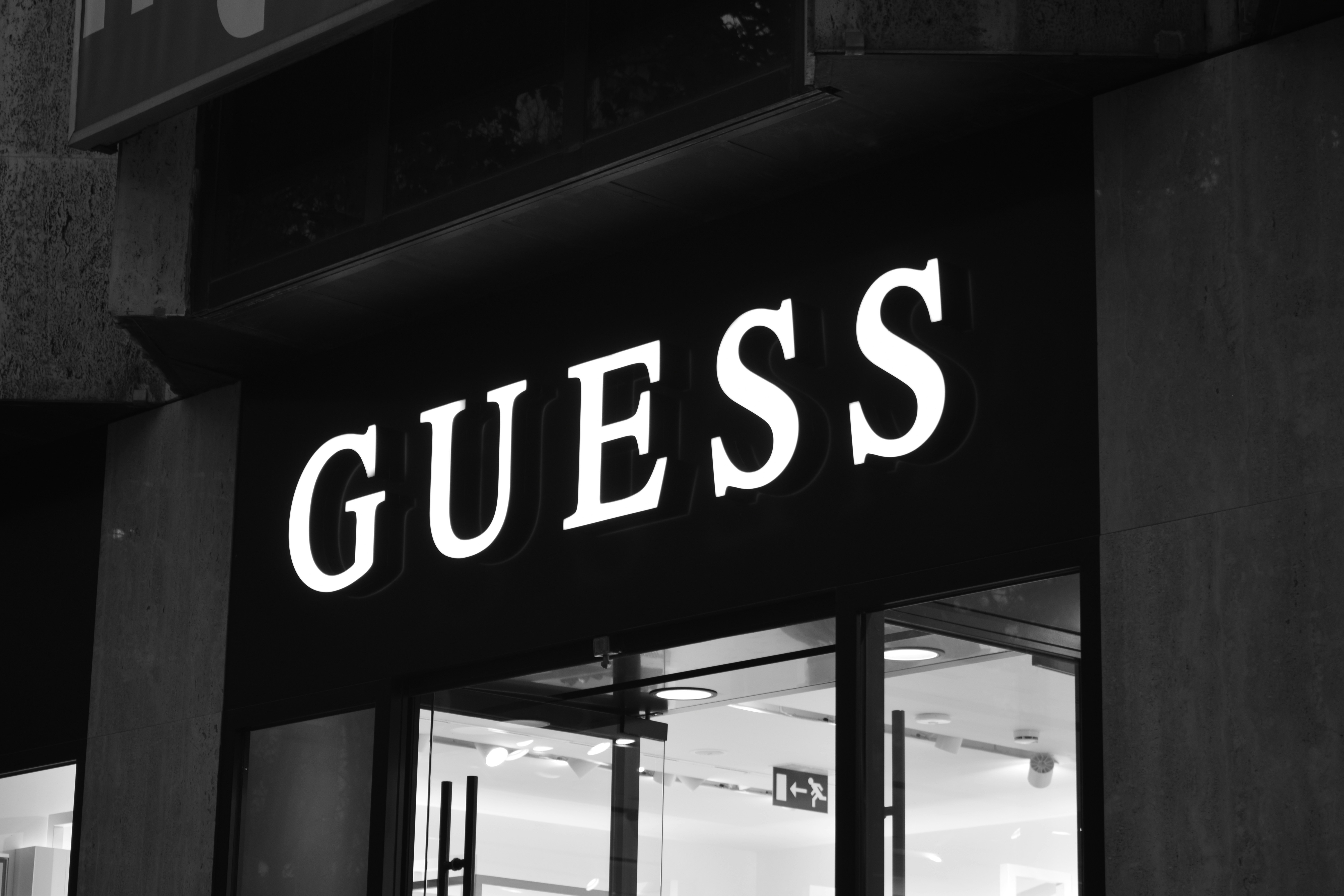 Black and white photo of a guess store