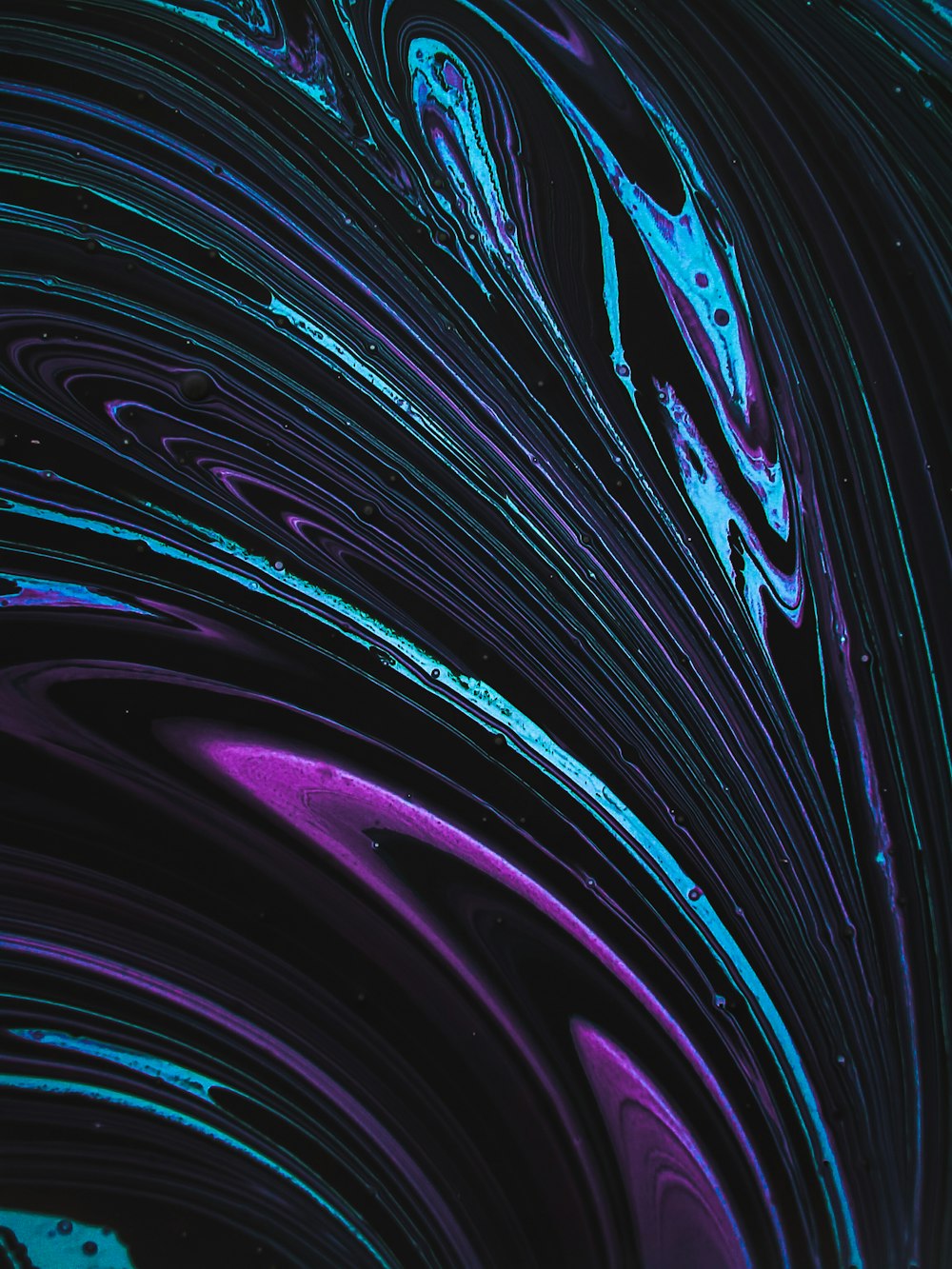 a close up of a blue and purple swirl