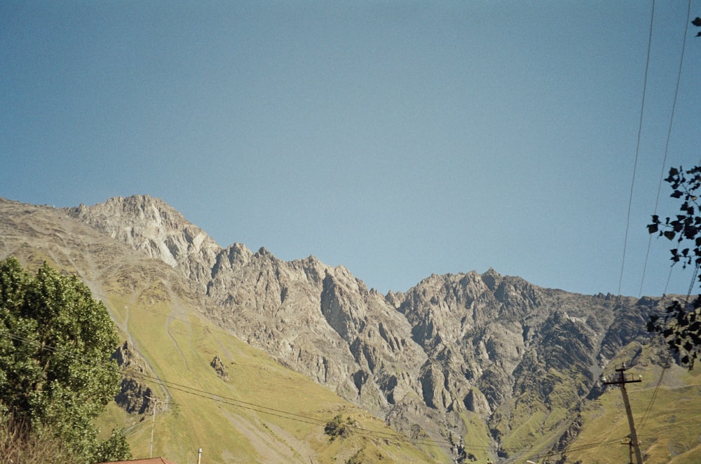 a view of a mountain range with a house in the foreground