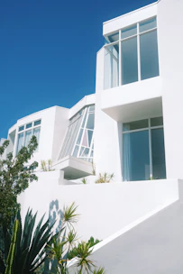 a tall white building with lots of windows