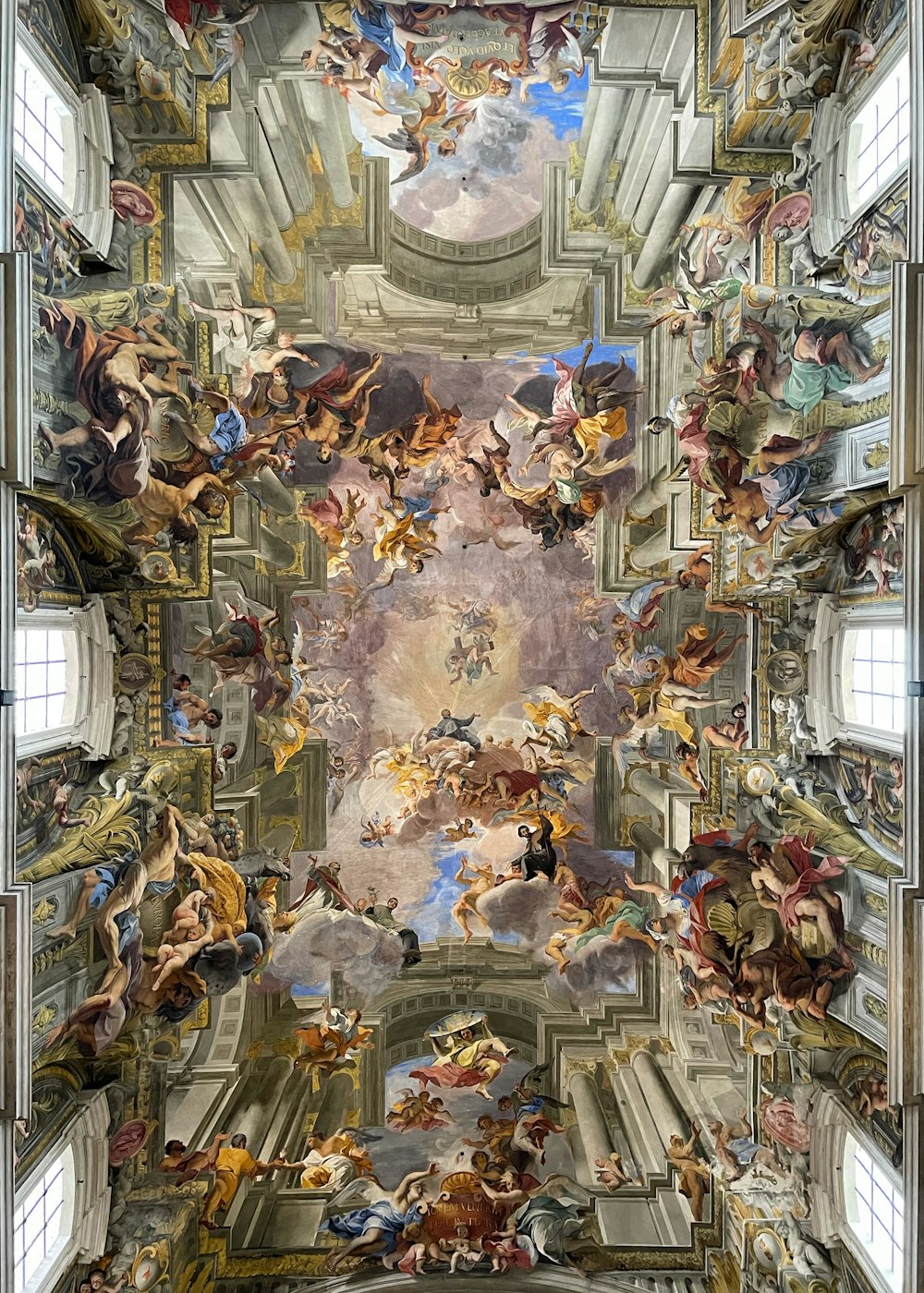 the ceiling of a building with many paintings on it