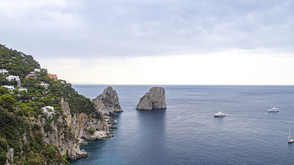 a group of boats floating on top of a large body of water