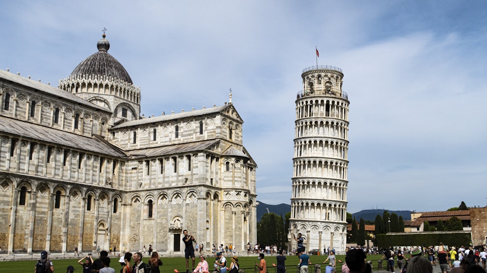 a group of people standing in front of a tall building