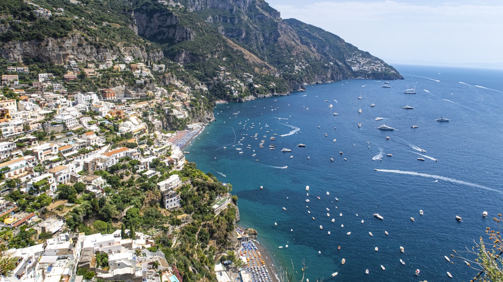 a group of boats floating on top of a body of water