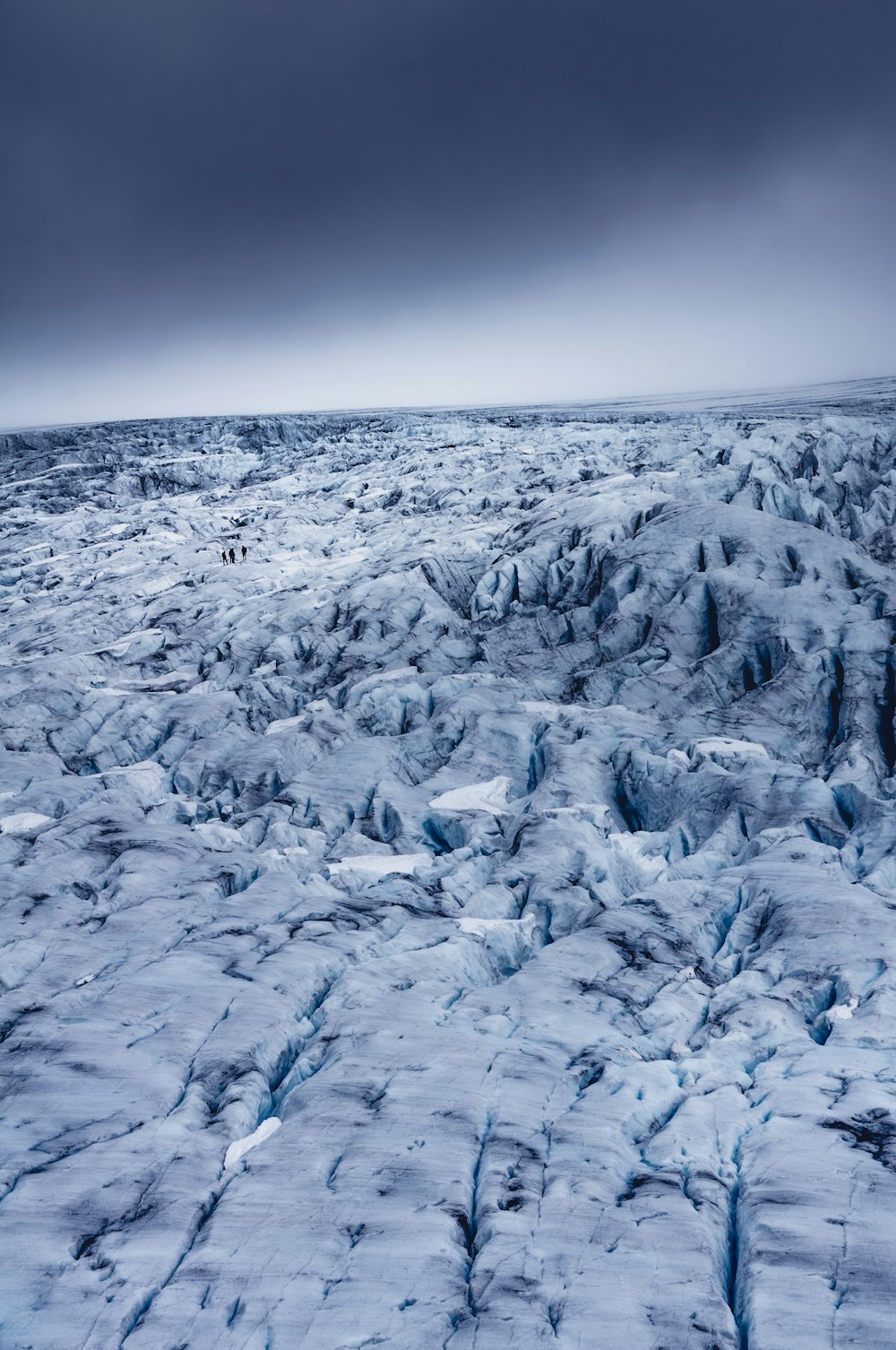 a large expanse of ice on a cloudy day