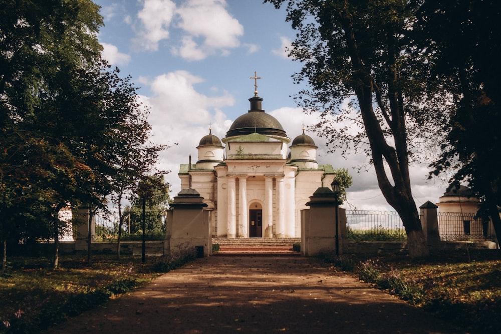 a white building with a cross on top of it