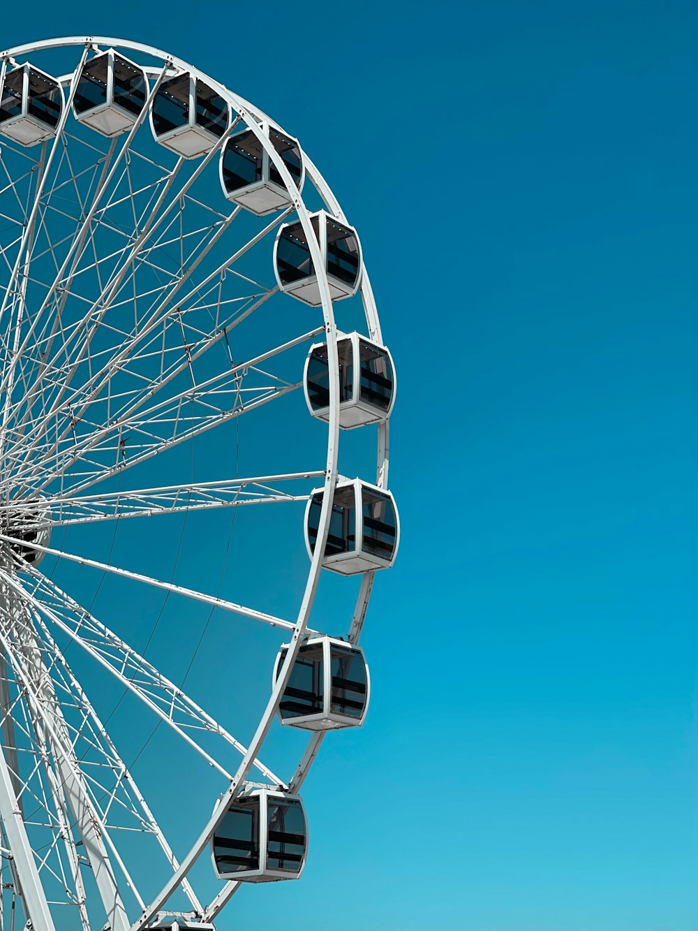 a large white ferris wheel on a clear day