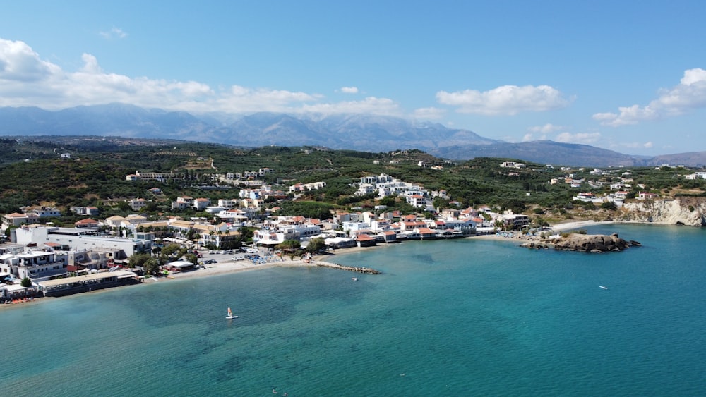 an aerial view of a small town by the ocean