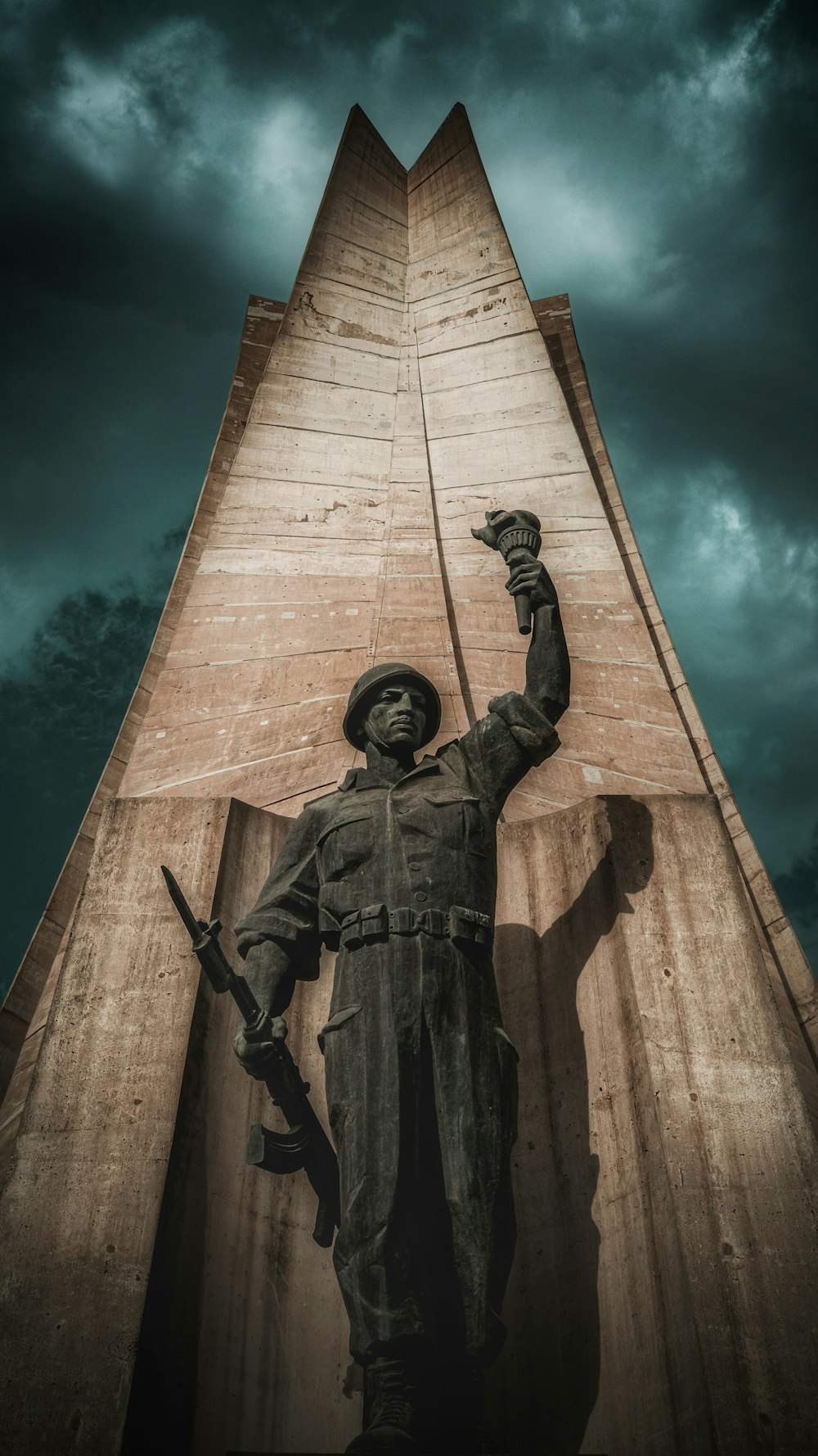 a statue of a man with a gun in his hand