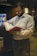 a man reading a book in a library