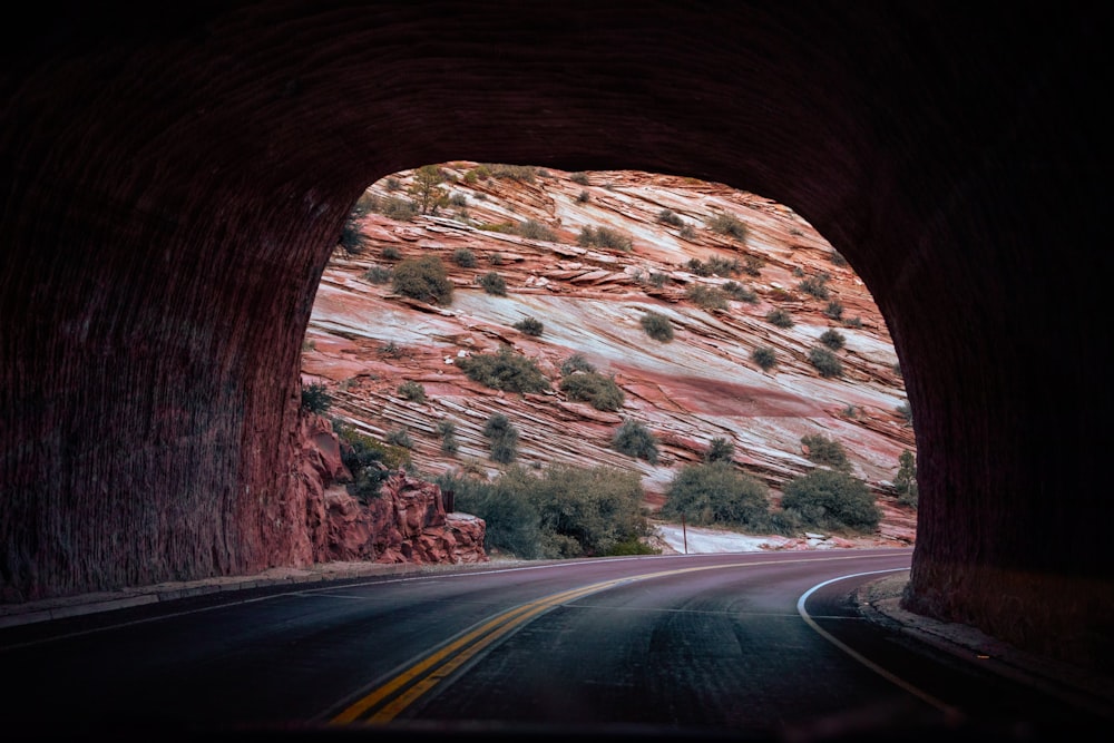 a tunnel with a mountain in the background