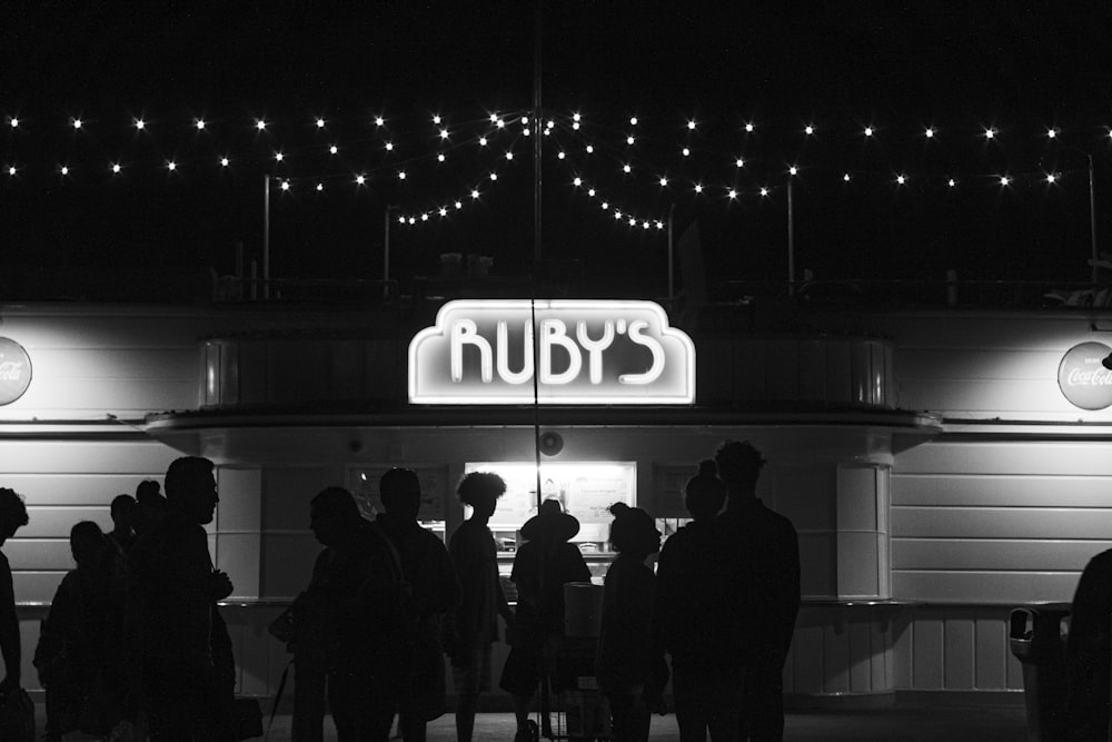 a group of people standing outside of a building