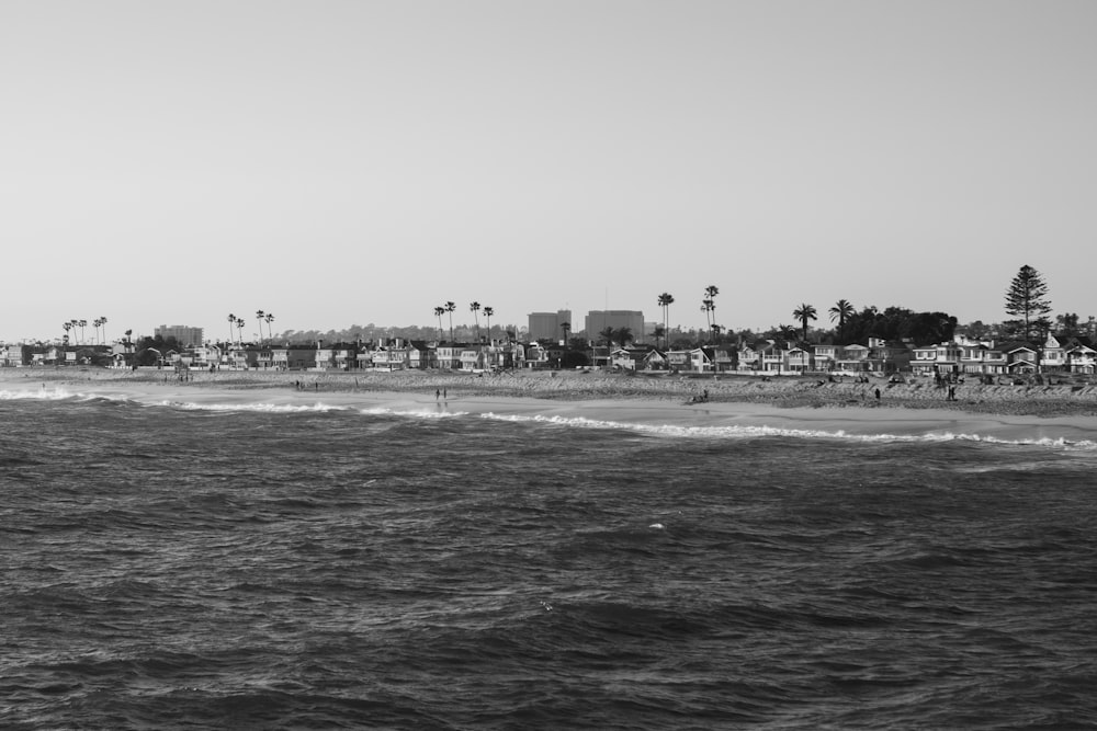 a black and white photo of a beach