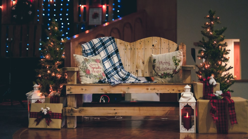 a wooden bench with christmas decorations on it