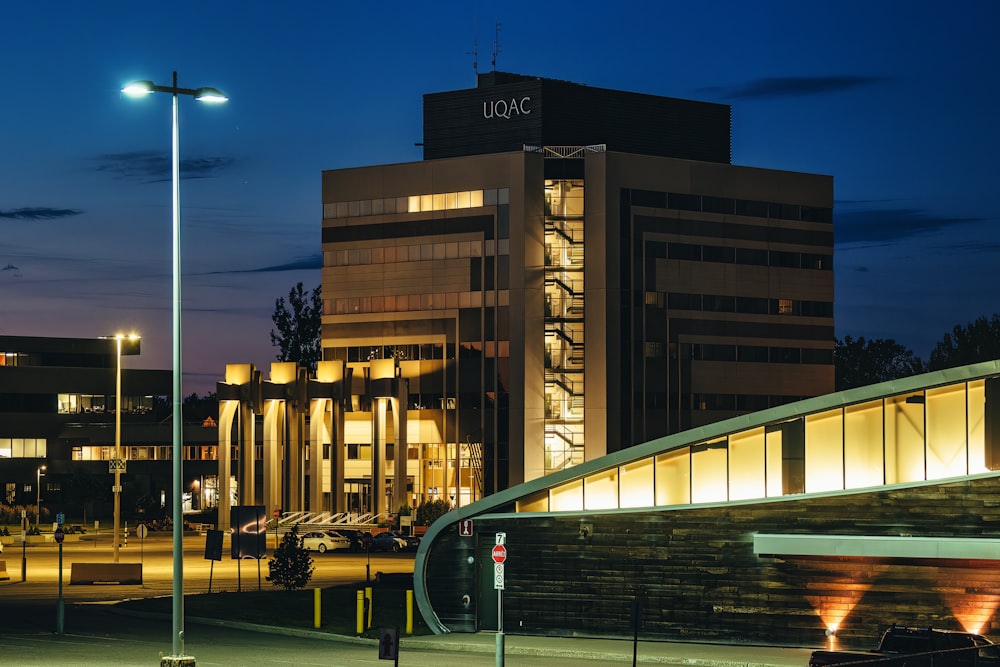 a building lit up at night with street lights