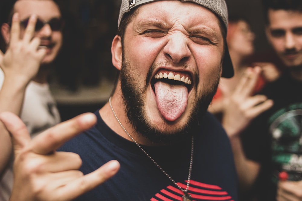 a man making a face with his tongue out
