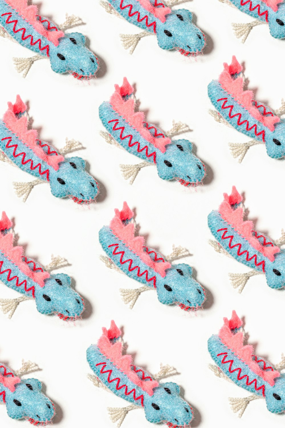 a close up of a pattern of blue and pink items