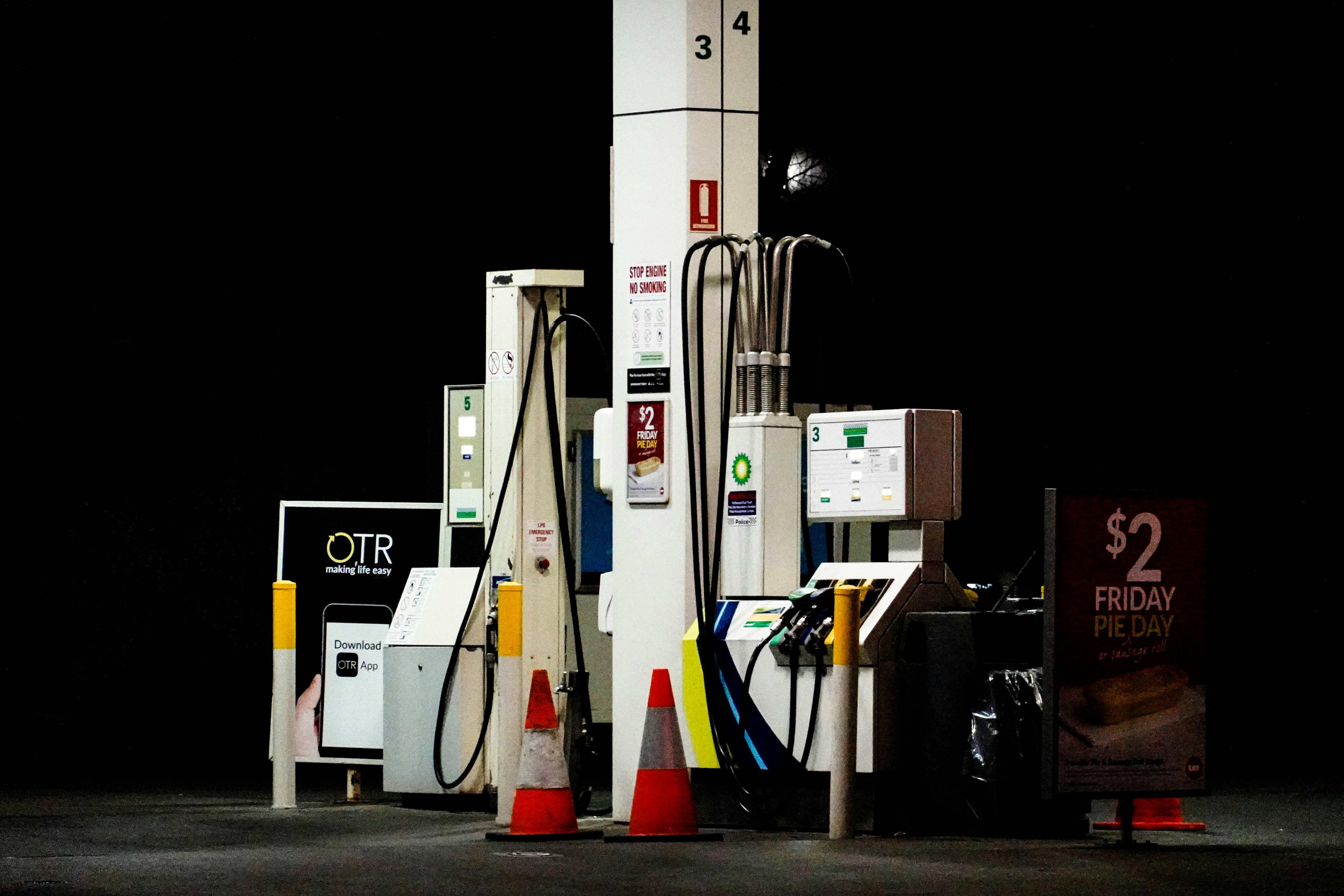 a group of gas pumps sitting next to each other