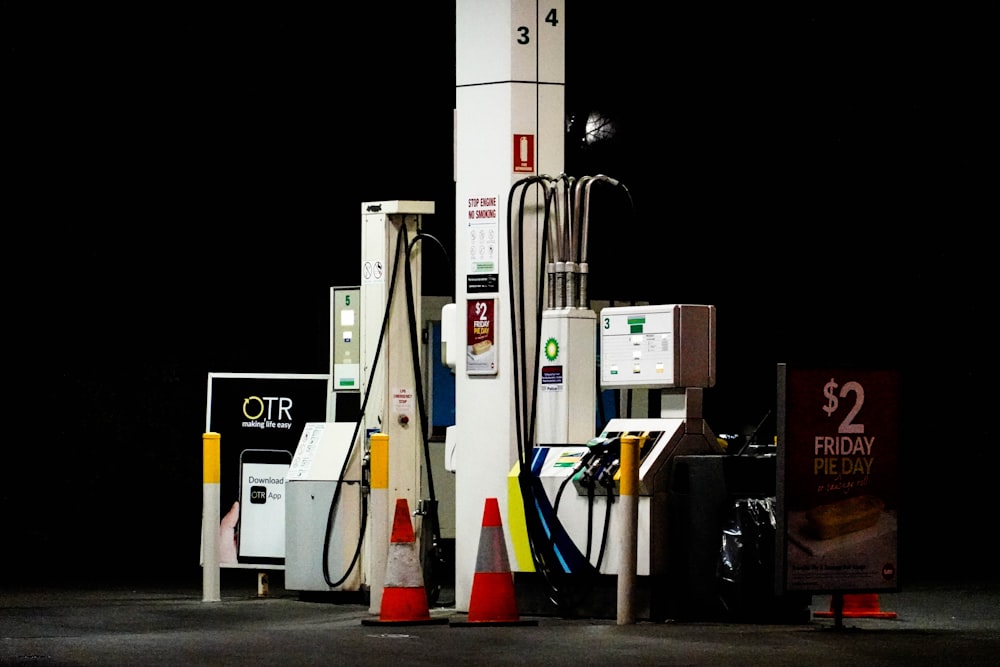 a group of gas pumps sitting next to each other