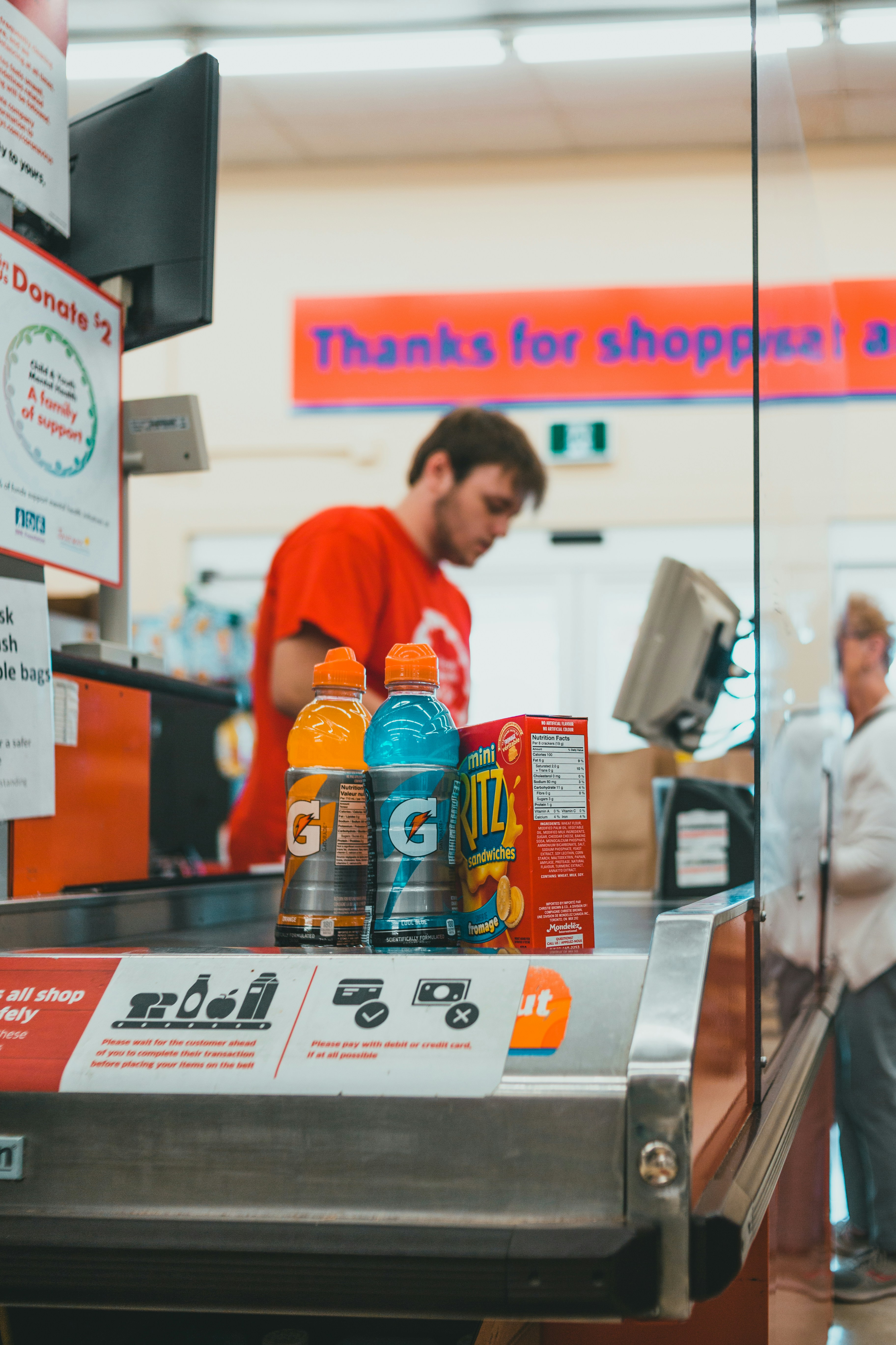 A man standing at a cash register in a store photo – Free Human Image ...