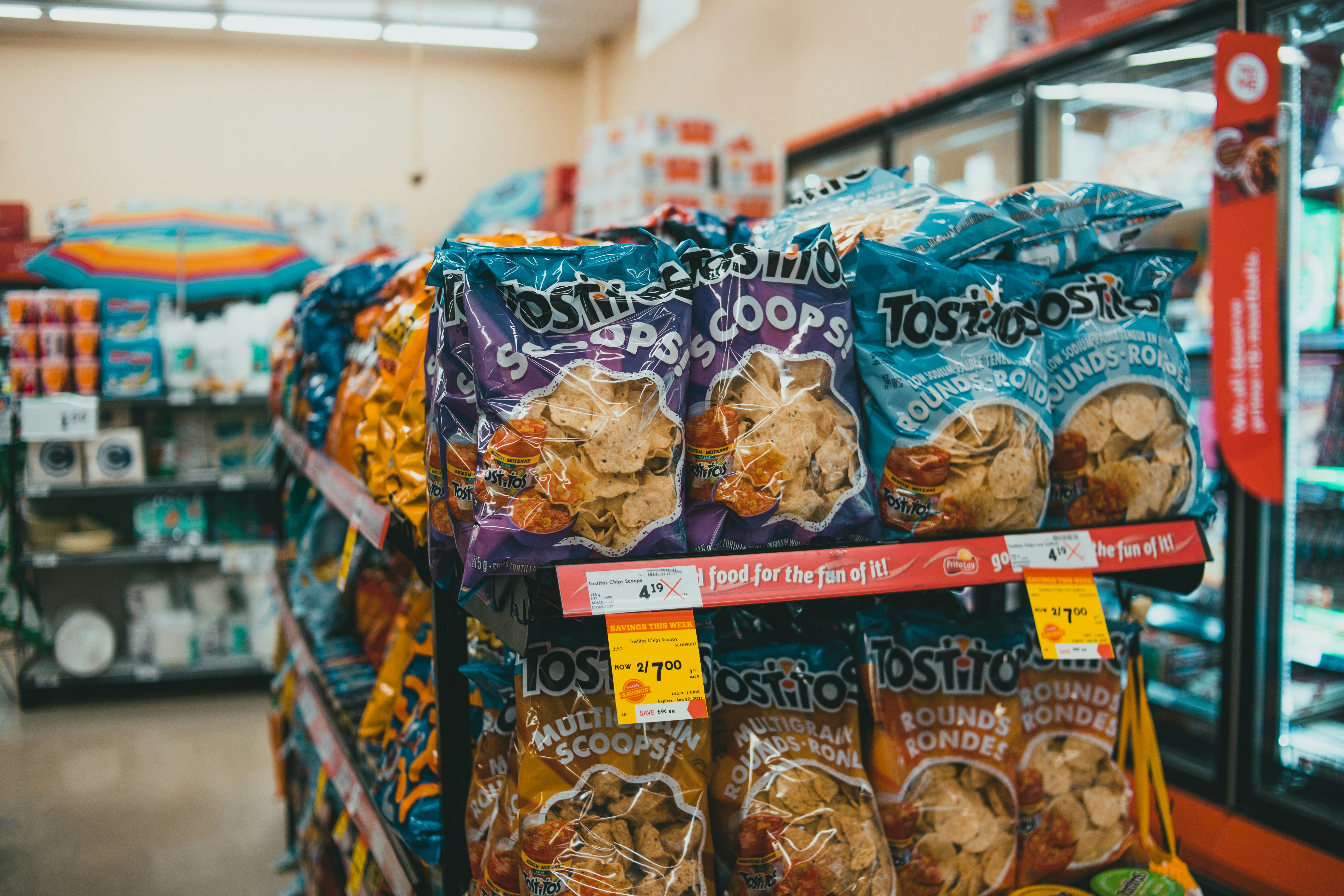 a store shelf filled with bags of food