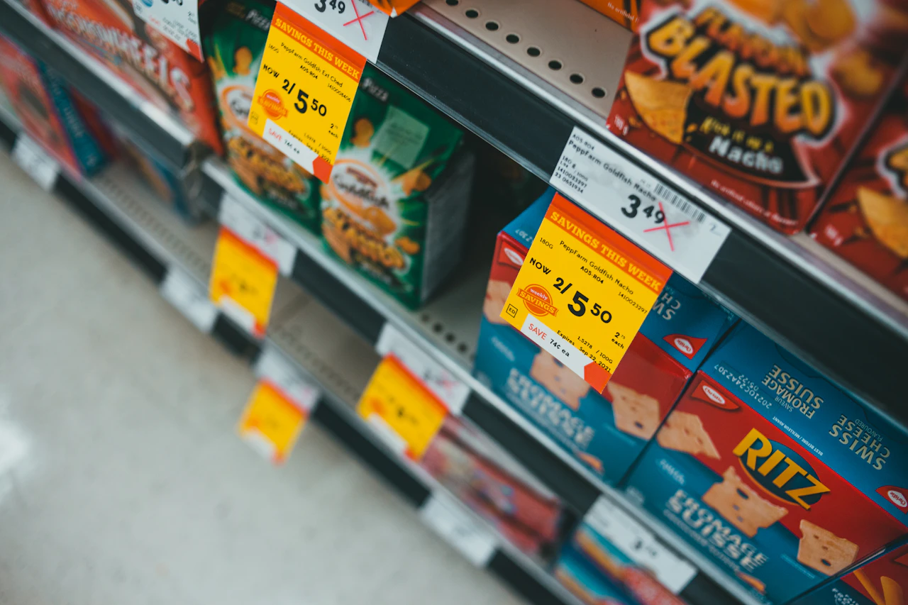 A fully stocked retail shelf, the count that has to stay accurate across the register, the online menu, and delivery